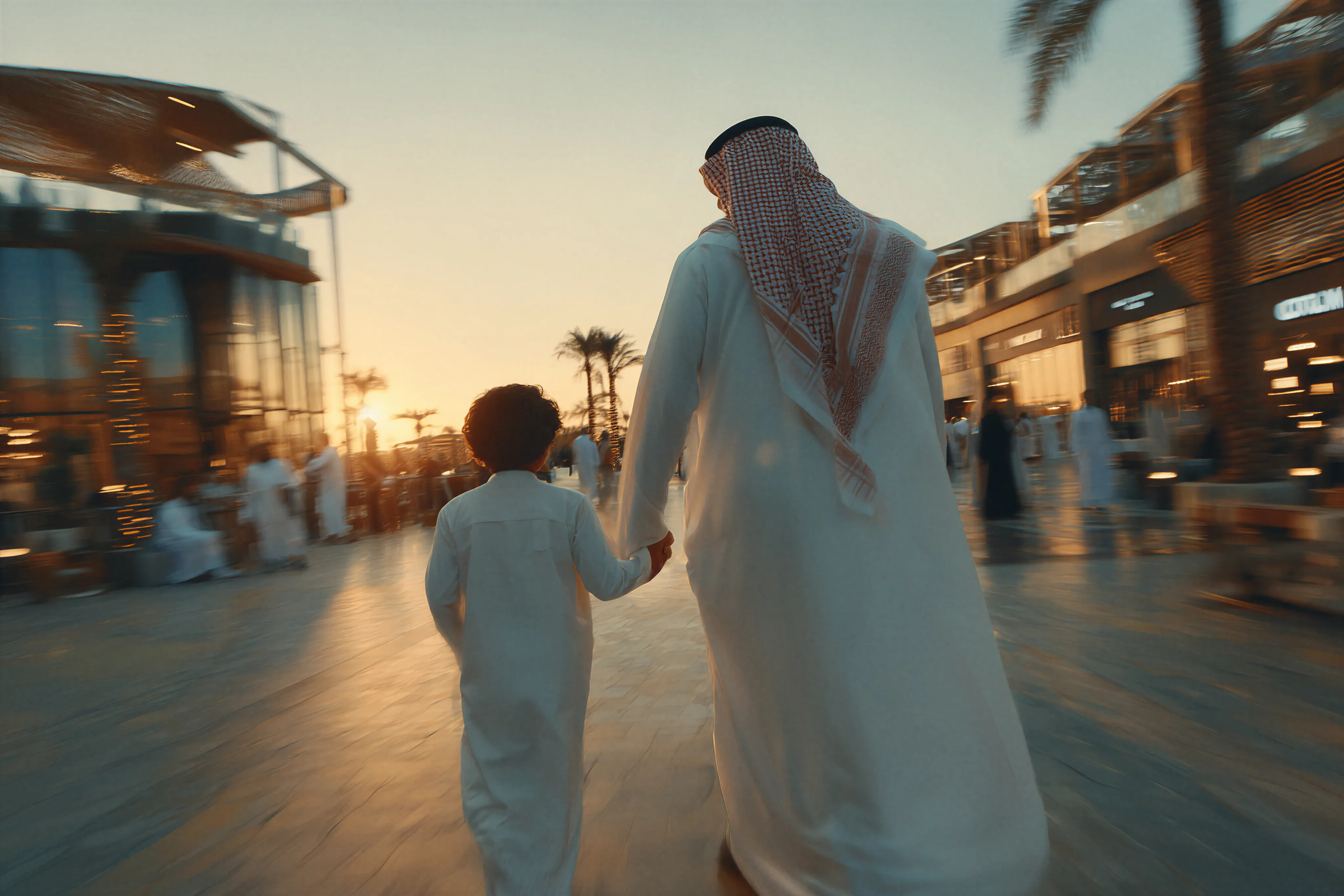 A father walking with his son at OSUS Residences